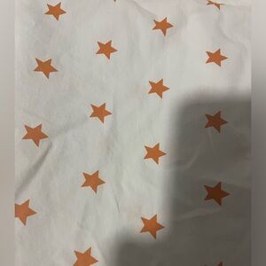 White Fabric with Orange Stars